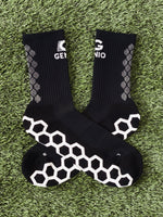 Black Genio grip socks.