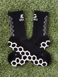 Black Genio grip socks.